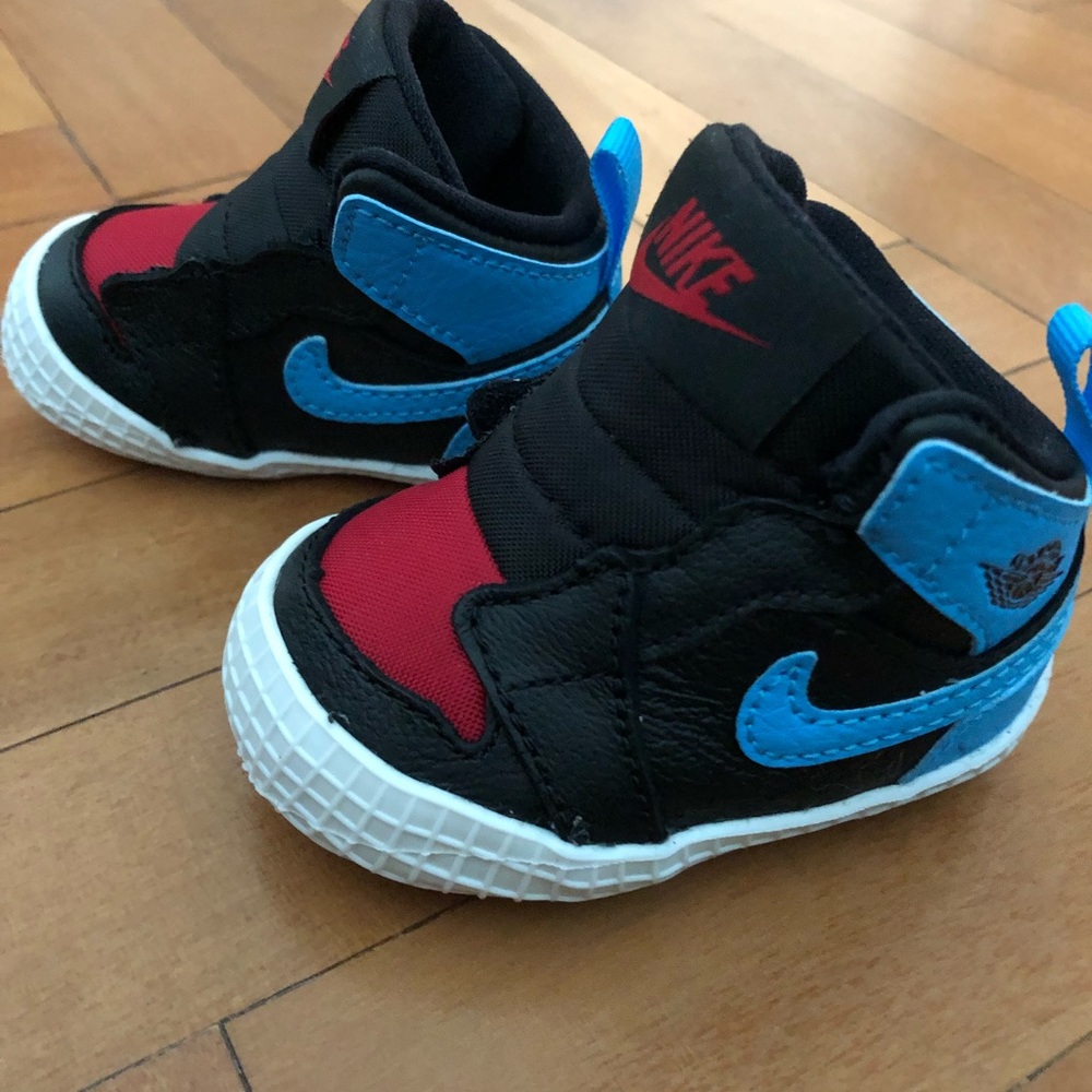 Baby Nike Jordan’s with velcro open/close.  Brand new in original box!
